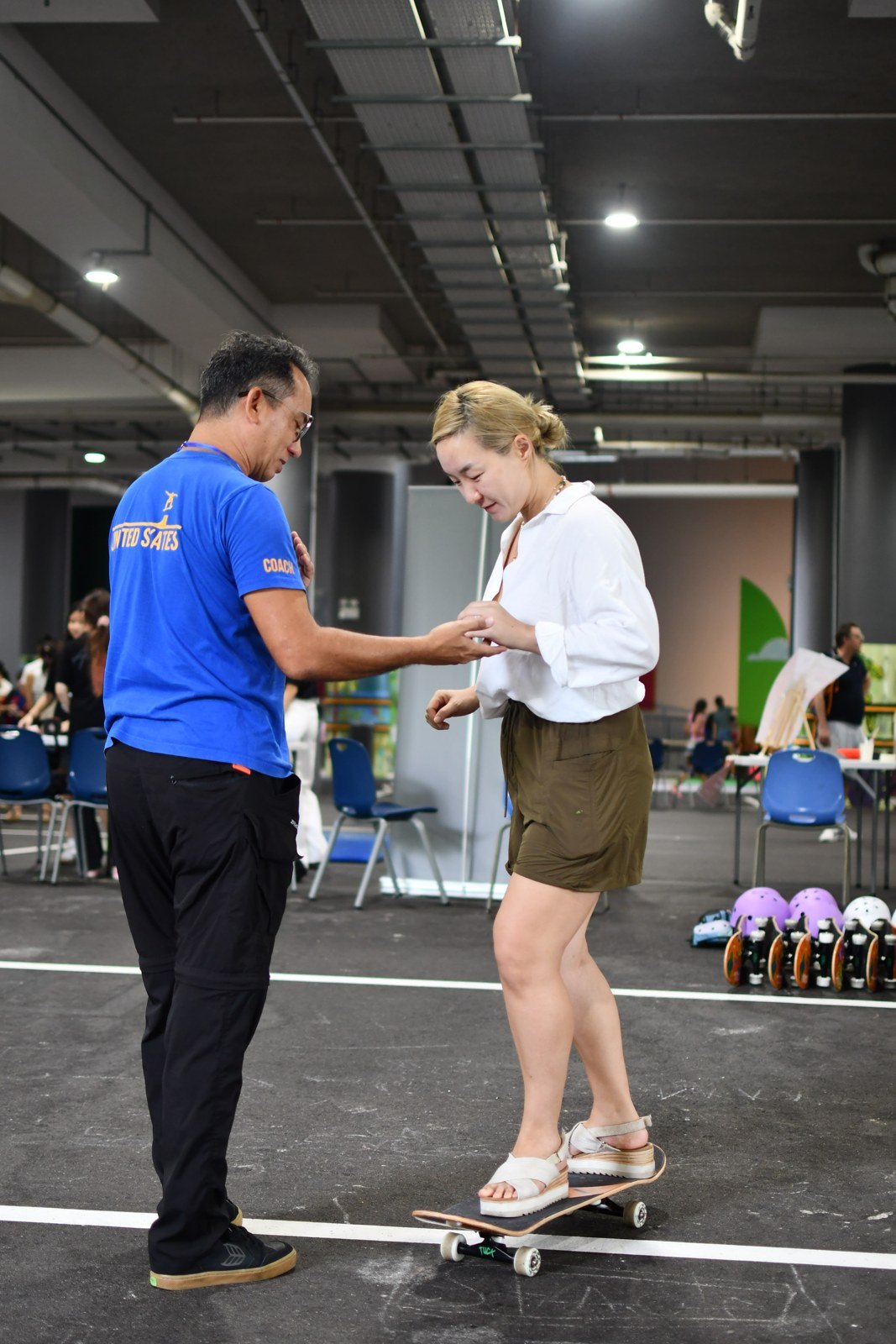 An instructor coaching a participant on balance and technique